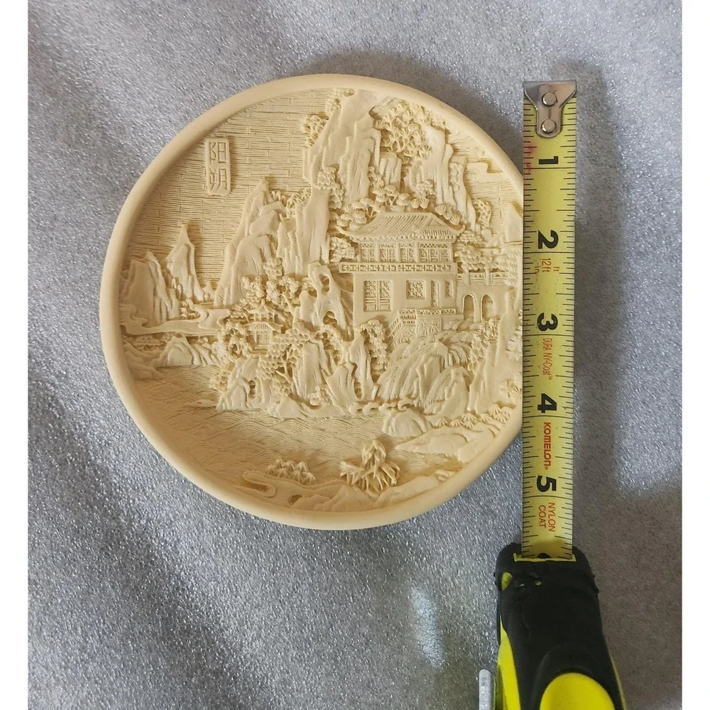 Vintage Chinese carved resin decorative plate with a landscape motif